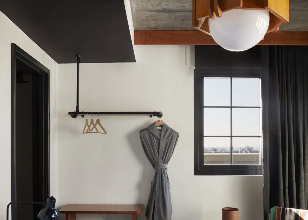 A dedicated bedroom with windows overlooking different parts of the city
