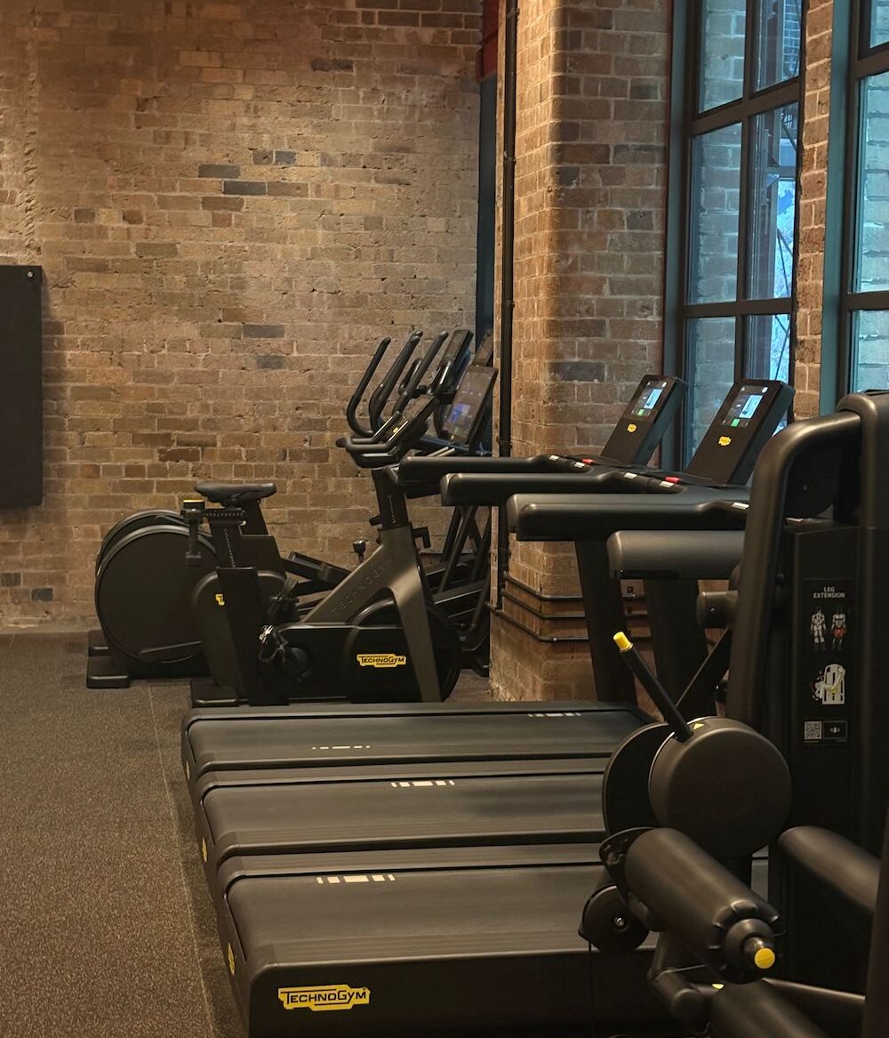 a photo of a gym with equipment that includes treadmills, elliptical machines and leg machine.